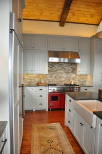 Custom built cabinets with apron front sink.