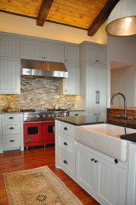 Custom built apron front sink with faucet built into island